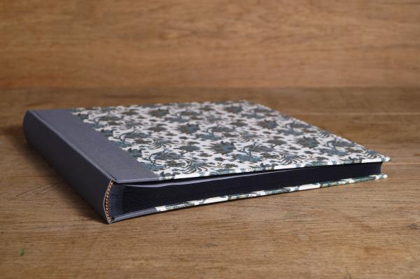 Square photo album with black pages with linen spine